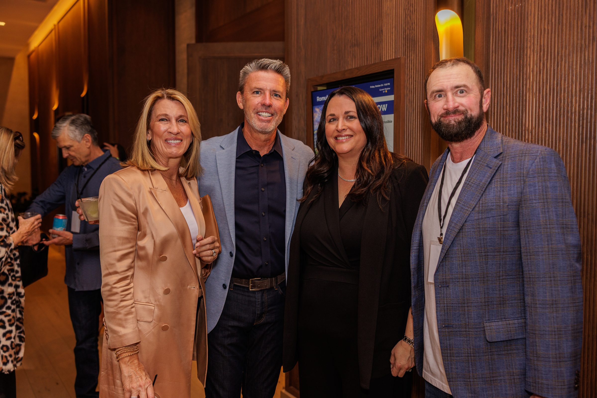 Four Treasure House supporters at an evening event