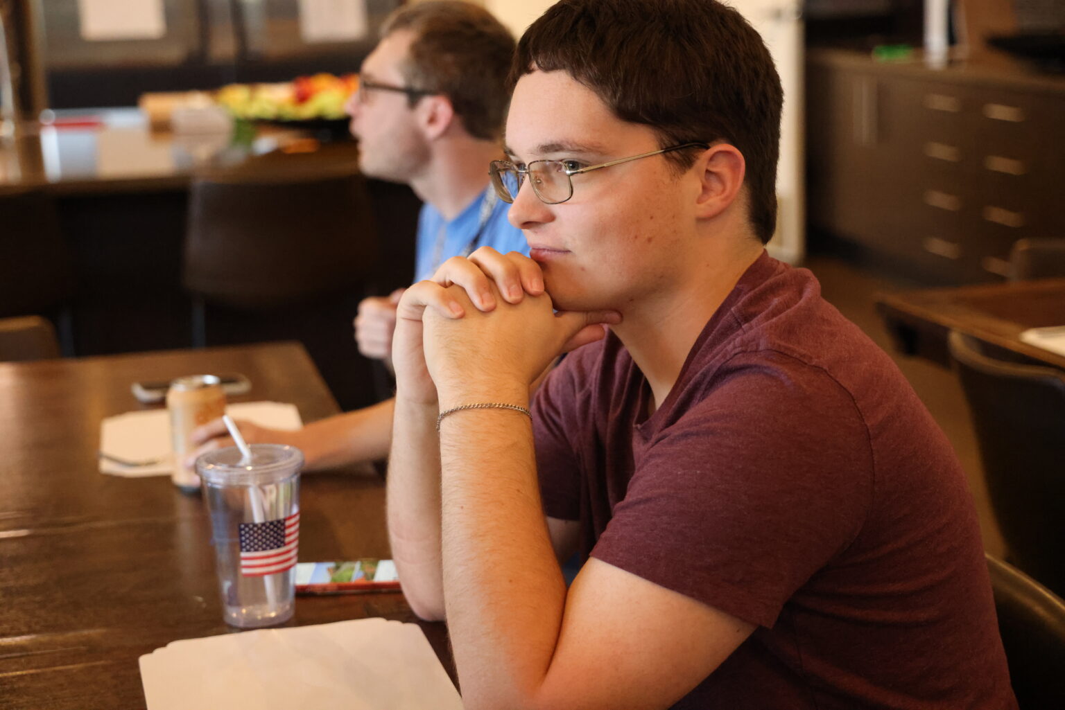A resident and a life coach talking over a meal